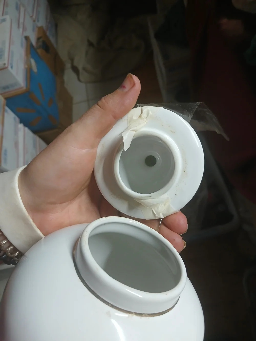 vintage Japanese white porcelain ginger jar featuring a metallic inlaid medallio